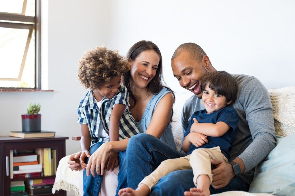 happy family sitting on the couch