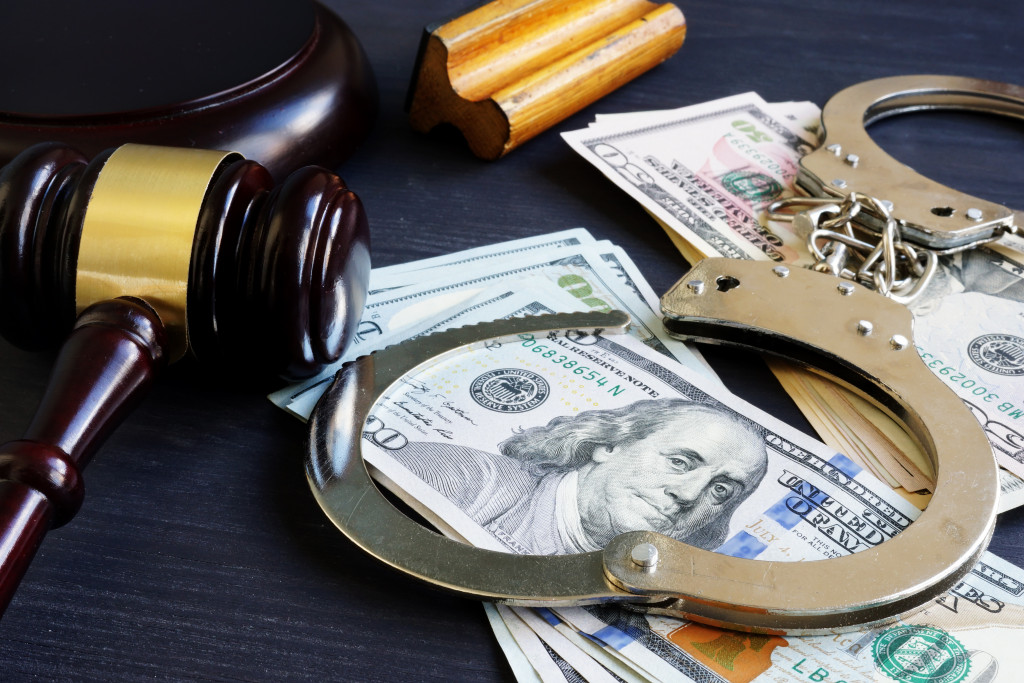 gavel, money, and handcuff