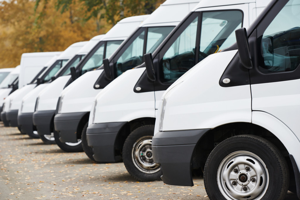 A row of parked commercial vans