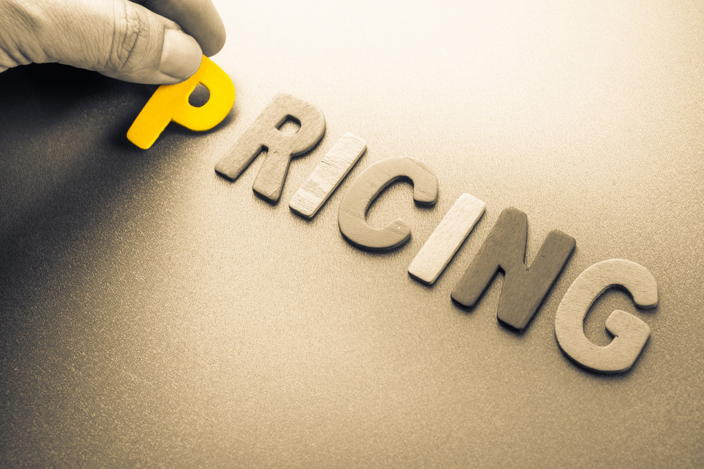 Visual representation of product pricing with the word pricing on a table.